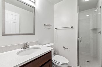 Tiled shower and tub surround - The Republic Apartments