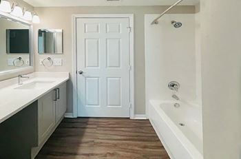 Upgraded bathroom countertops in select units - Versant Place Apartments
