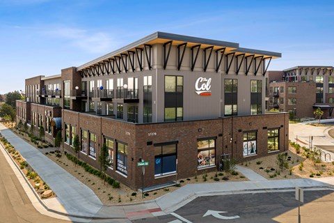 A modern building with a Coca Cola sign on the front.