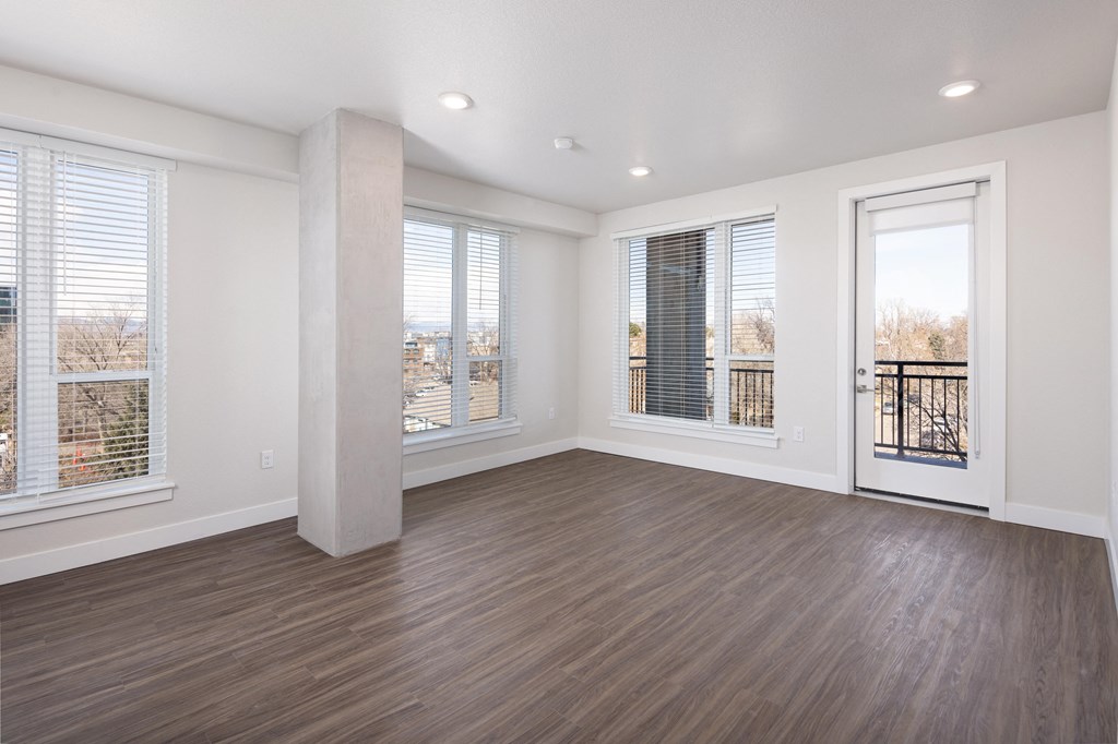 A room with wooden floors and white walls.