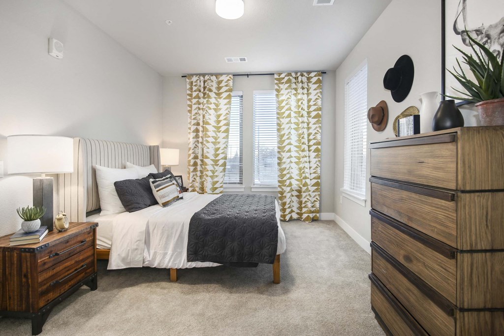 a bedroom with a bed and a dresser