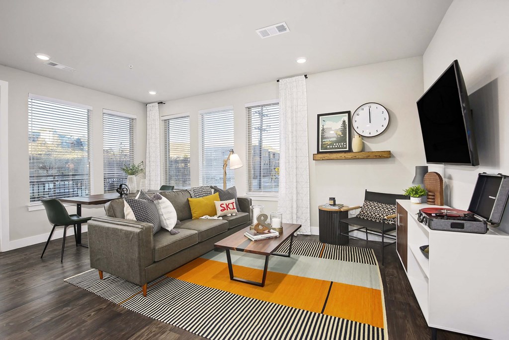 a living room with a couch and a tv