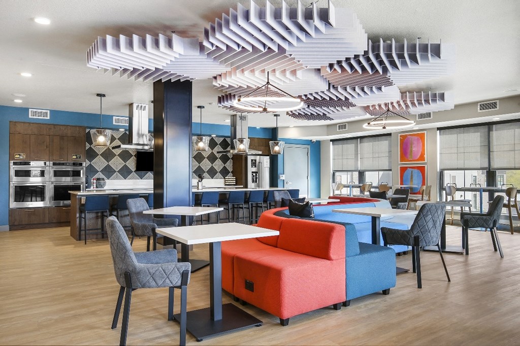 a rendering of a restaurant and lounge area with tables and chairs