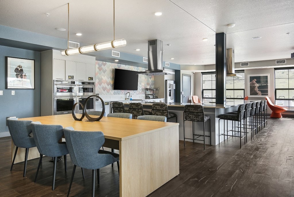 a kitchen and dining room with a table and chairs