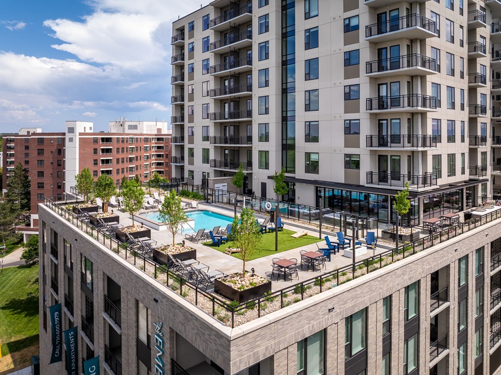 A large building with a pool in the middle of it.