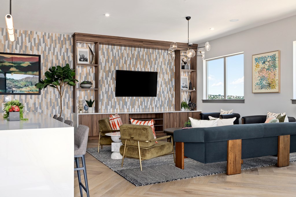 A living room with a television, a sofa, and a coffee table.