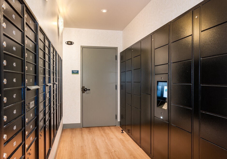 a row of lockers in a room with a door