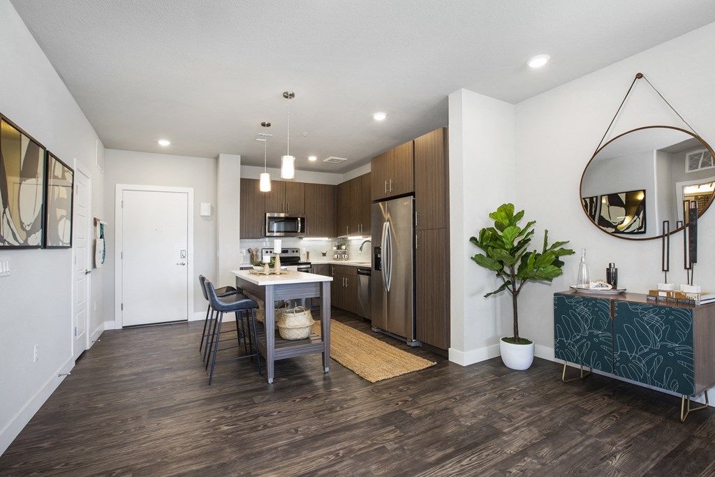 a living room with a kitchen and a dining room