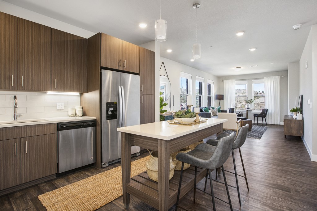 a kitchen with a large island and a dining table