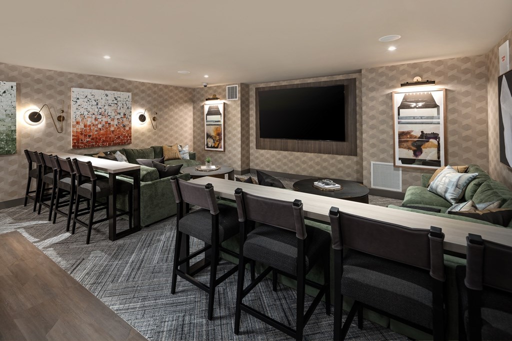 A conference room with a long table and chairs.