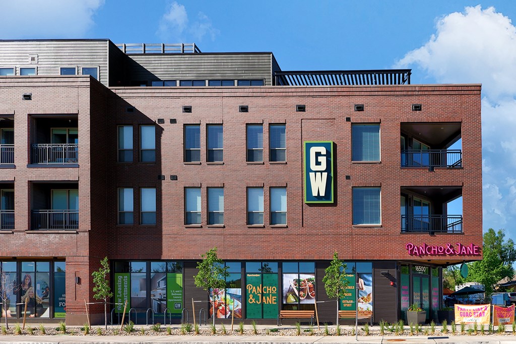 a brick building with a sign on the side of it