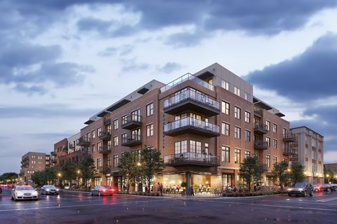 a rendering of an apartment building on a city street
