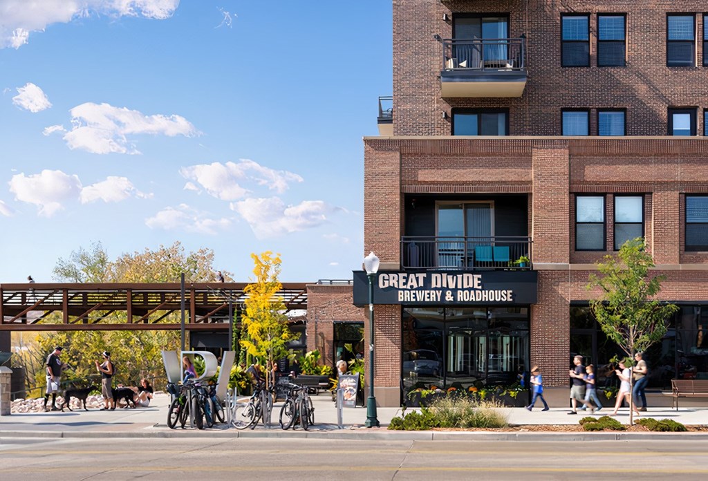 A street view of a building with the sign "Great Divide Brewery & Roadhouse".