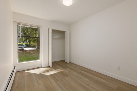 A room with a window and a door.