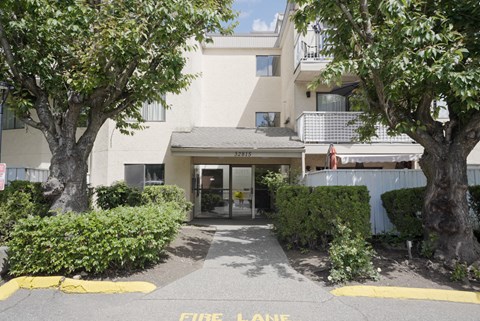 A building with a fire lane in front.