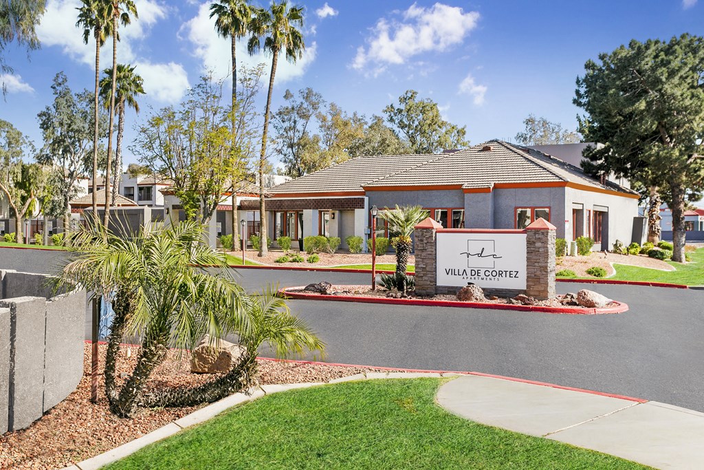 a home with a sign that says villa court in front of it