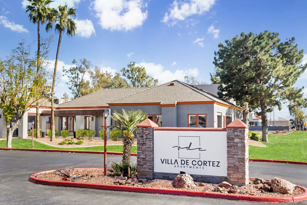 a home in villa de cortez with a sign in front of it
