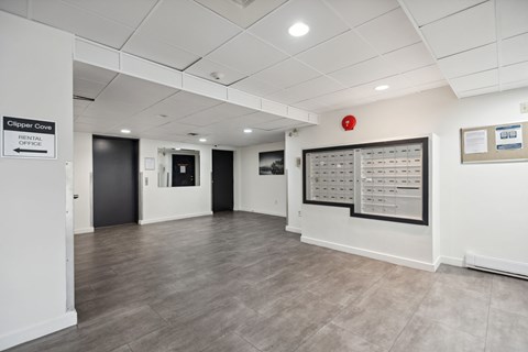 A white office space with a sign that says Clipper Cove.