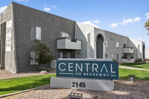 A building with a sign that says Central on Broadway. at Central on Broadway Apartments, Arizona, 85202