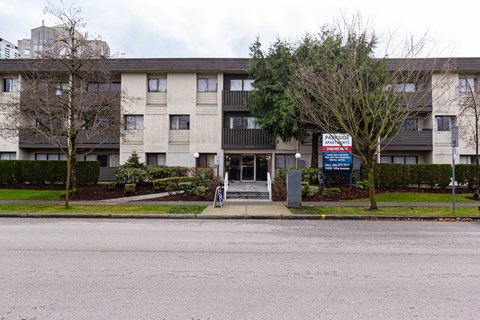 A large apartment complex with a sign that says "PANORAMA".