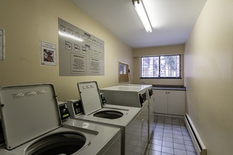 A small kitchen with a sink and a window.