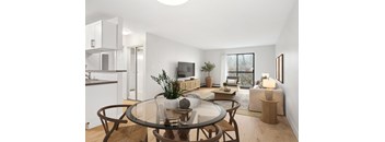 A modern living room with a glass table and brown chairs.