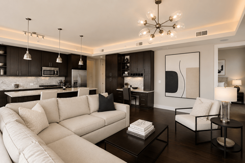 A modern living room with a white sofa and a coffee table.