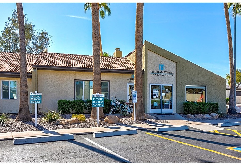 a building with palm trees in front of it