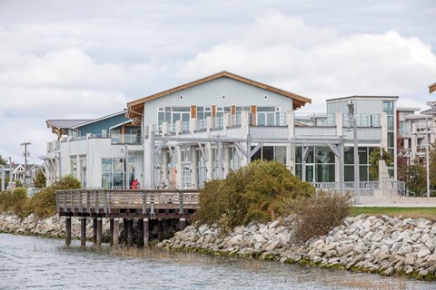 A house with a pier in front of it.
