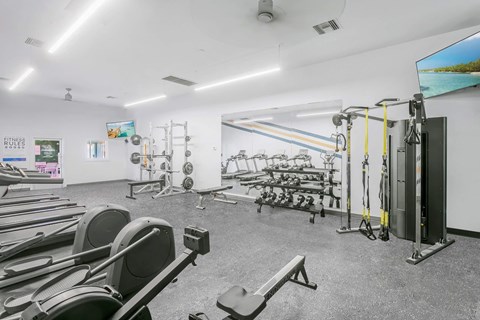Fitness center with cardio and weight equipment at Villa de Cortez Apartments, Arizona