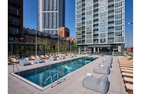 a pool on the rooftop of an apartment building
