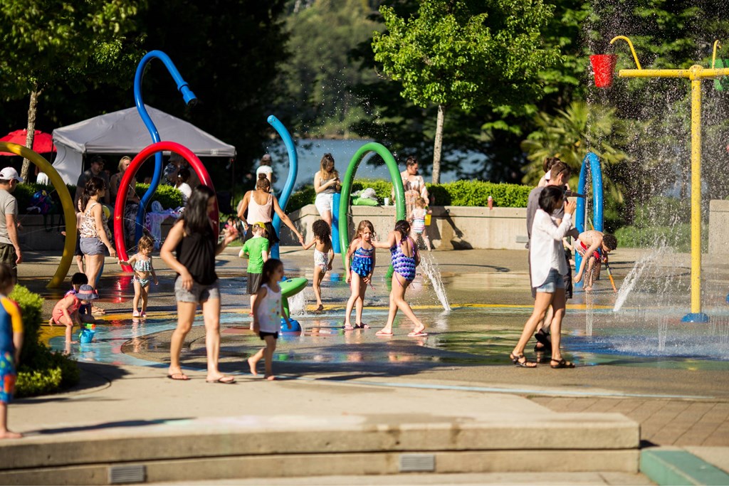 A group of people are playing in a water park.