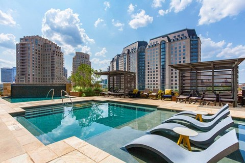 Rooftop swimming pool with skyline views at Uptown by Onni Apartments, Texas, 75201