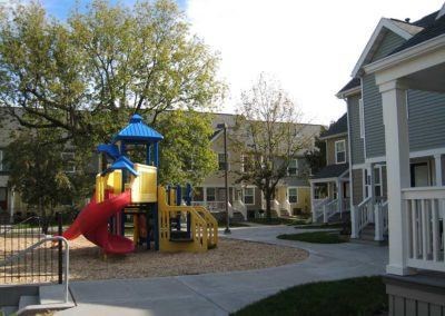 a playground in the middle of an apartment complex