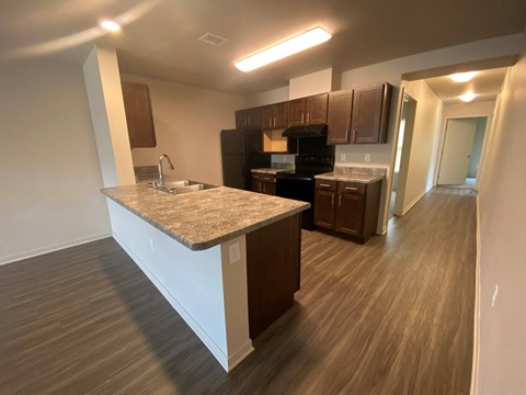 a kitchen with an island and a stove and a
