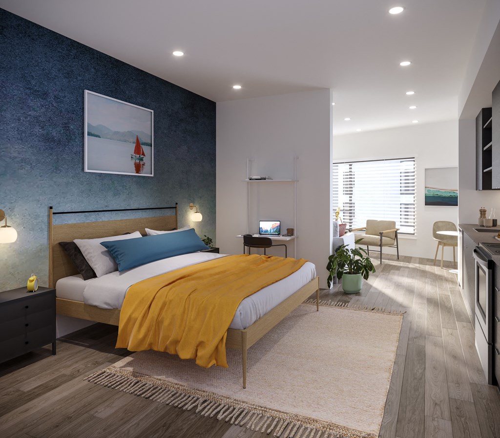 a bedroom with a bed and a desk