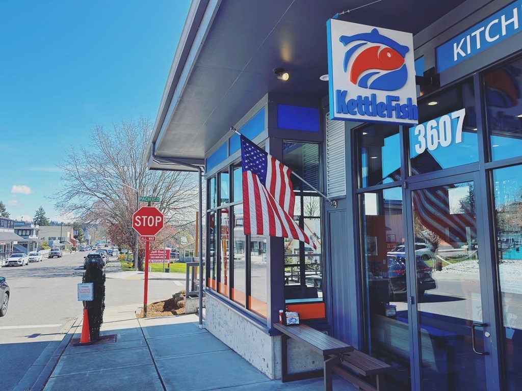 a red stop sign sitting in front of a building at Rivulet, Silverdale