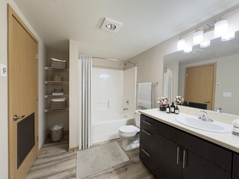 a bathroom with a sink and a toilet and a shower at Spyglass Hill Apartments, Washington