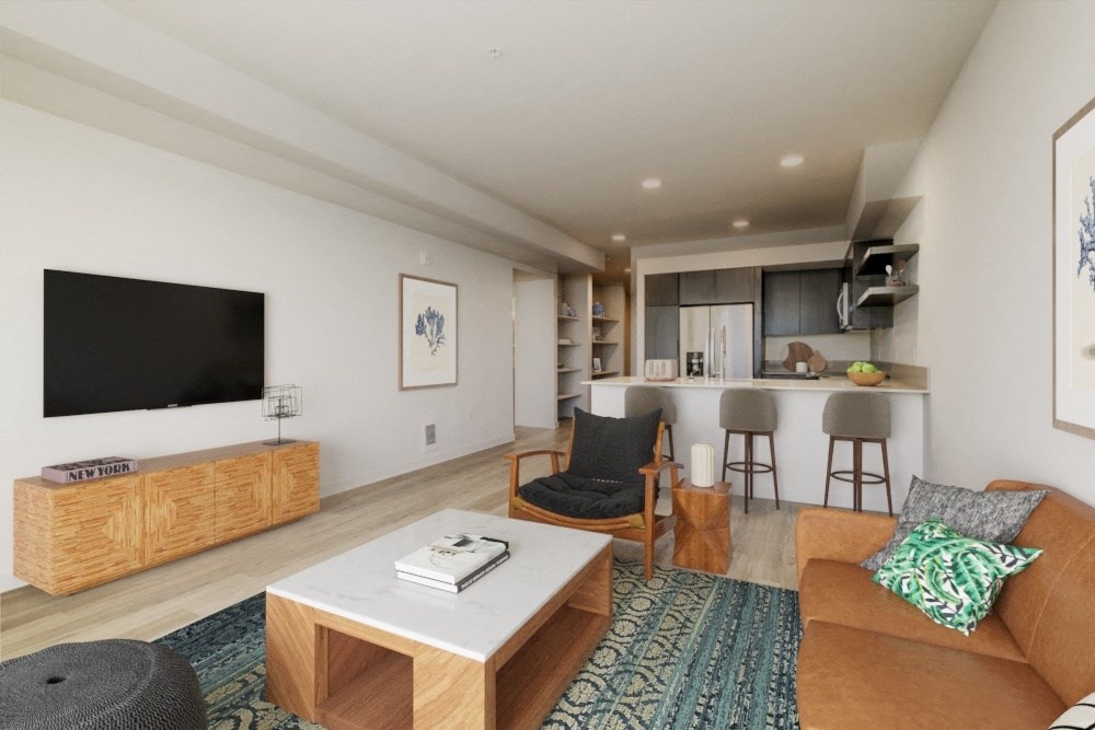 a living room with a couch coffee table and a television