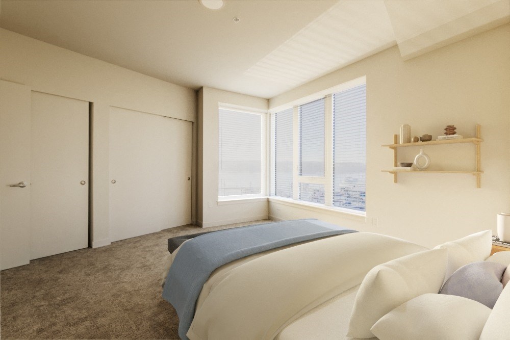 a bedroom with a large bed and a large window