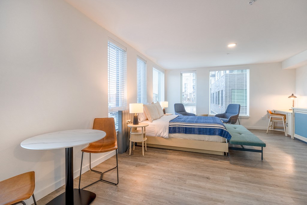 a bedroom with a bed and a desk in a room at Marina Square, WA 98337