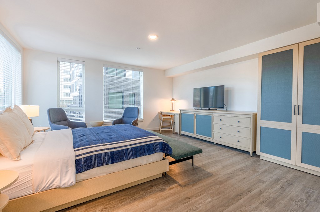 a bedroom with a bed and a television at Marina Square, Bremerton, WA