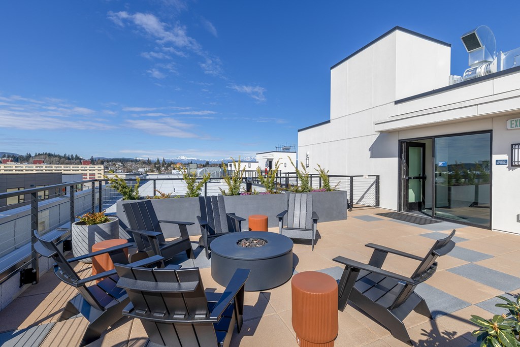 a terrace with a table and chairs on a sunny day at Marina Square, Washington