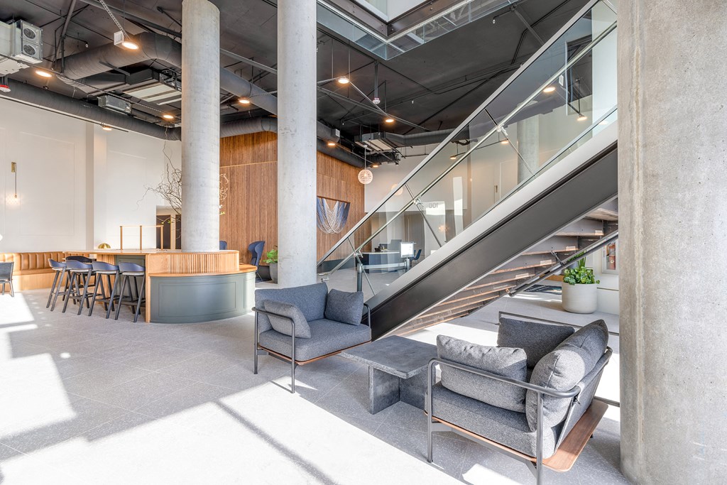Lobby with staircase, ample seating, and natural light at Marina Square, Bremerton, Washington 98337