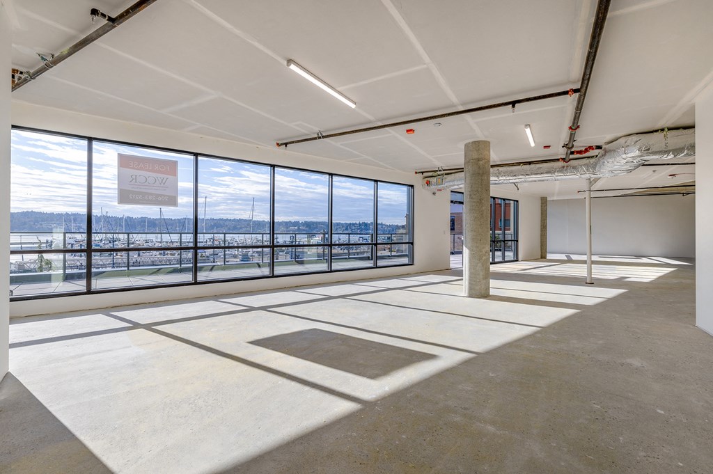 a large room with large windows and a column in the middle of the room at Marina Square, Washington, 98337