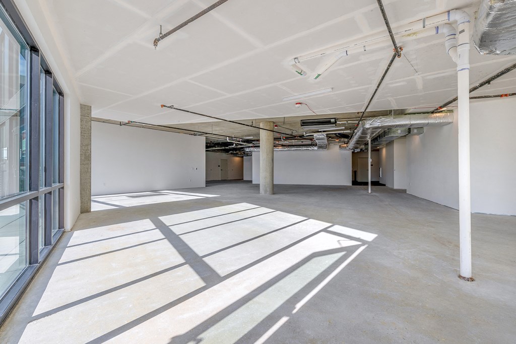 a large room with white walls and a large window at Marina Square, Bremerton