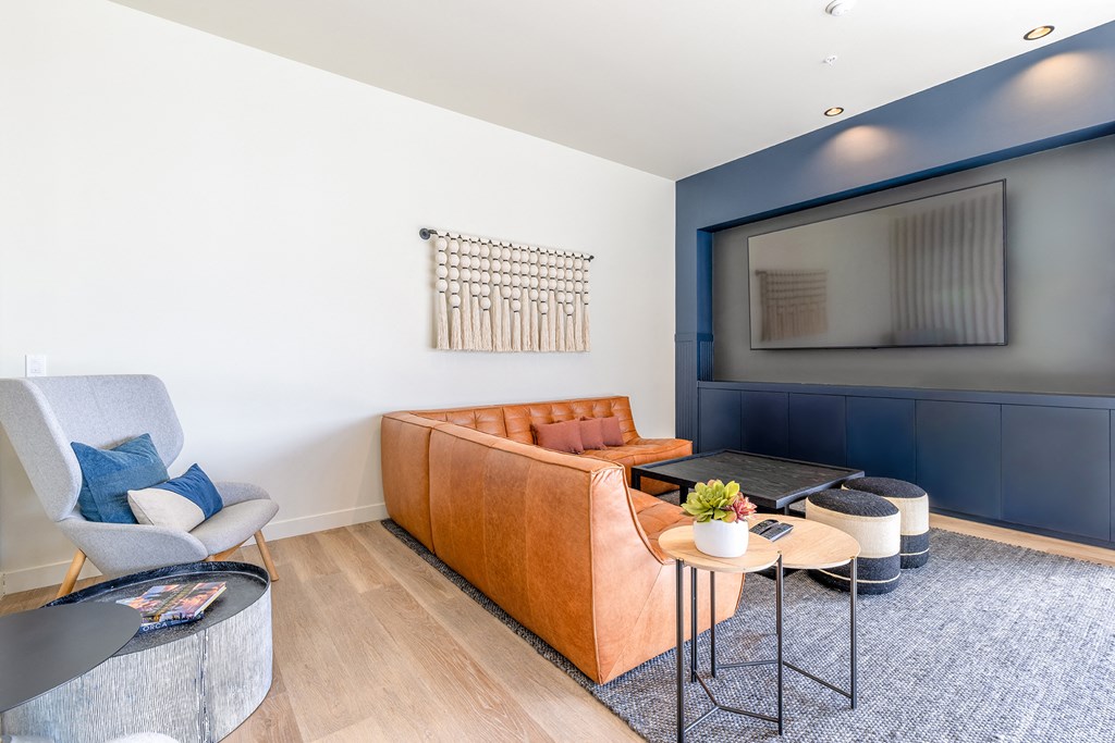 a living room with white walls and a blue accent wall at Marina Square, Bremerton, WA