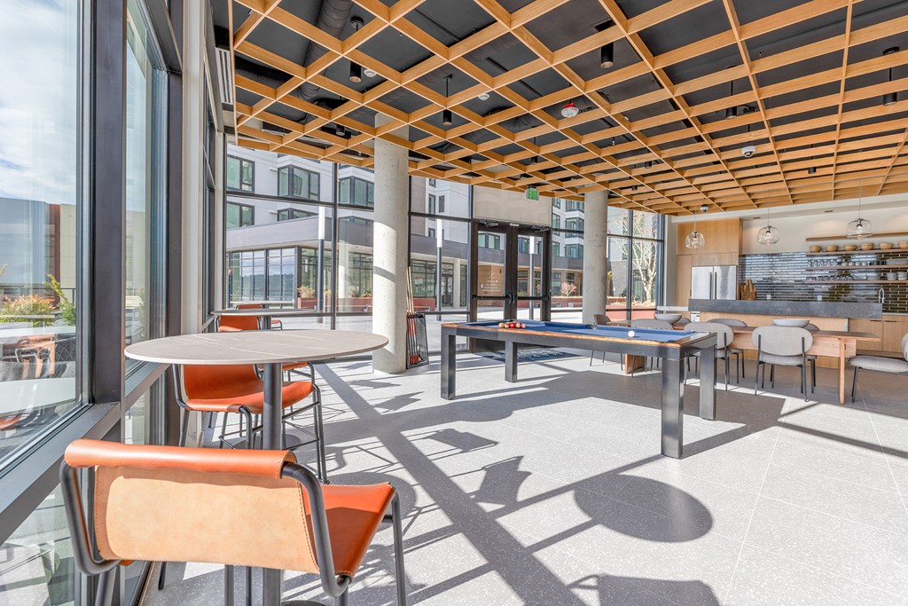 a common area with tables and chairs and a ping pong table at Marina Square, Bremerton, 98337