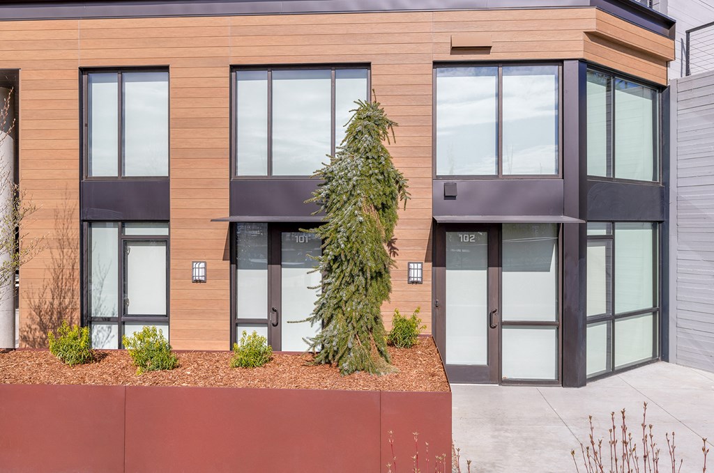 a tree in front of a building at Marina Square, Washington, 98337