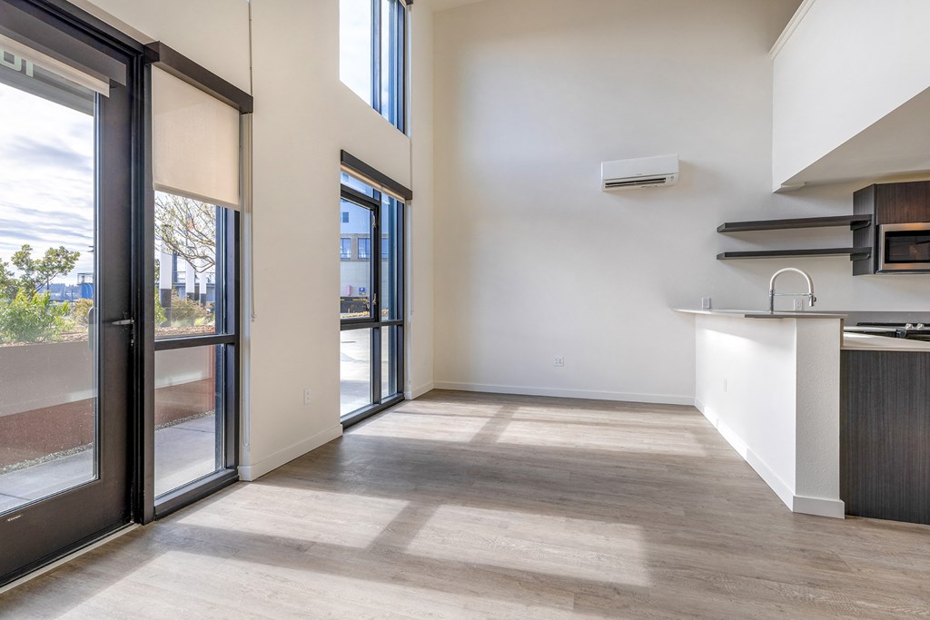 a kitchen and living room with sliding glass doors at Marina Square, WA 98337